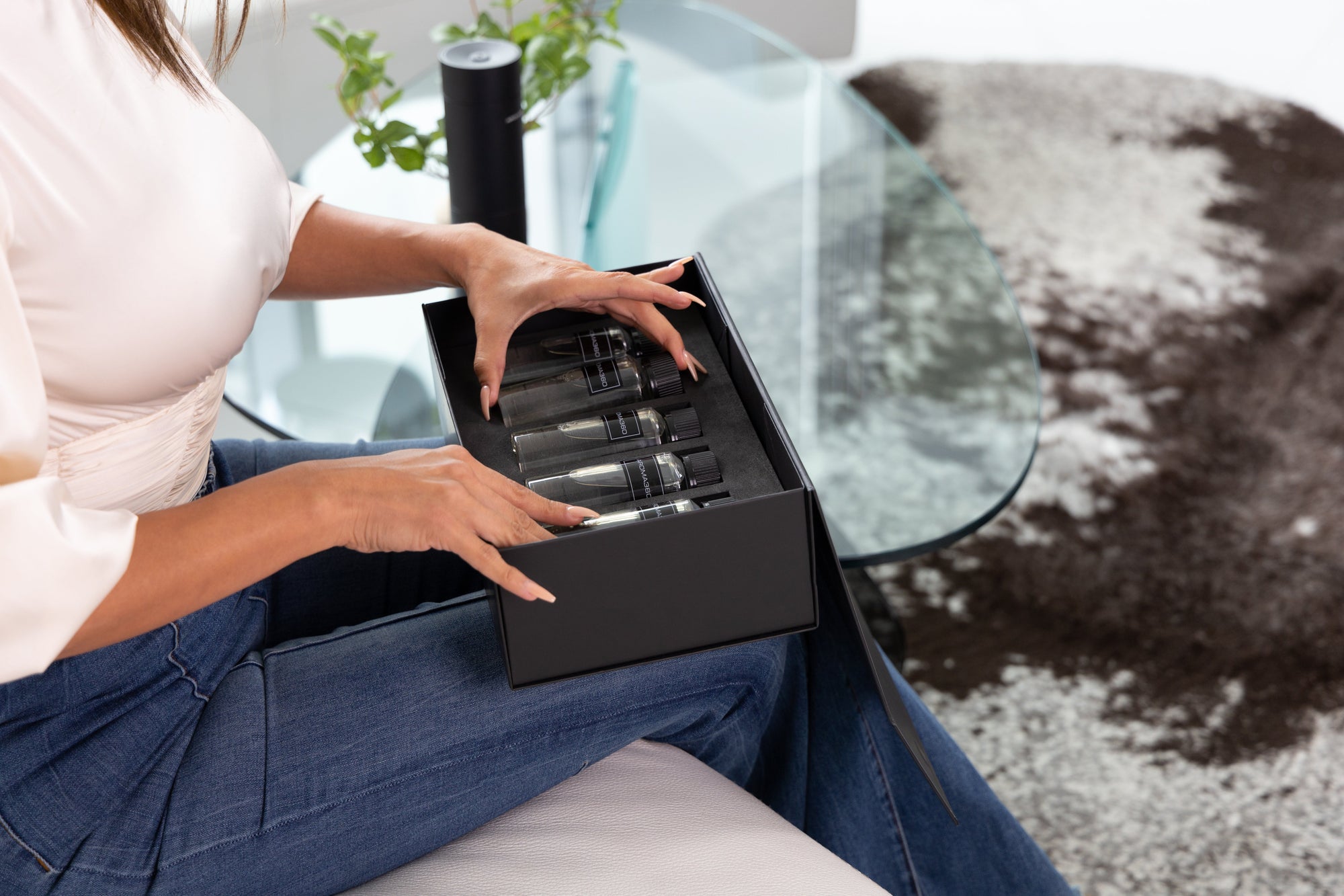 woman opening diffuser oils