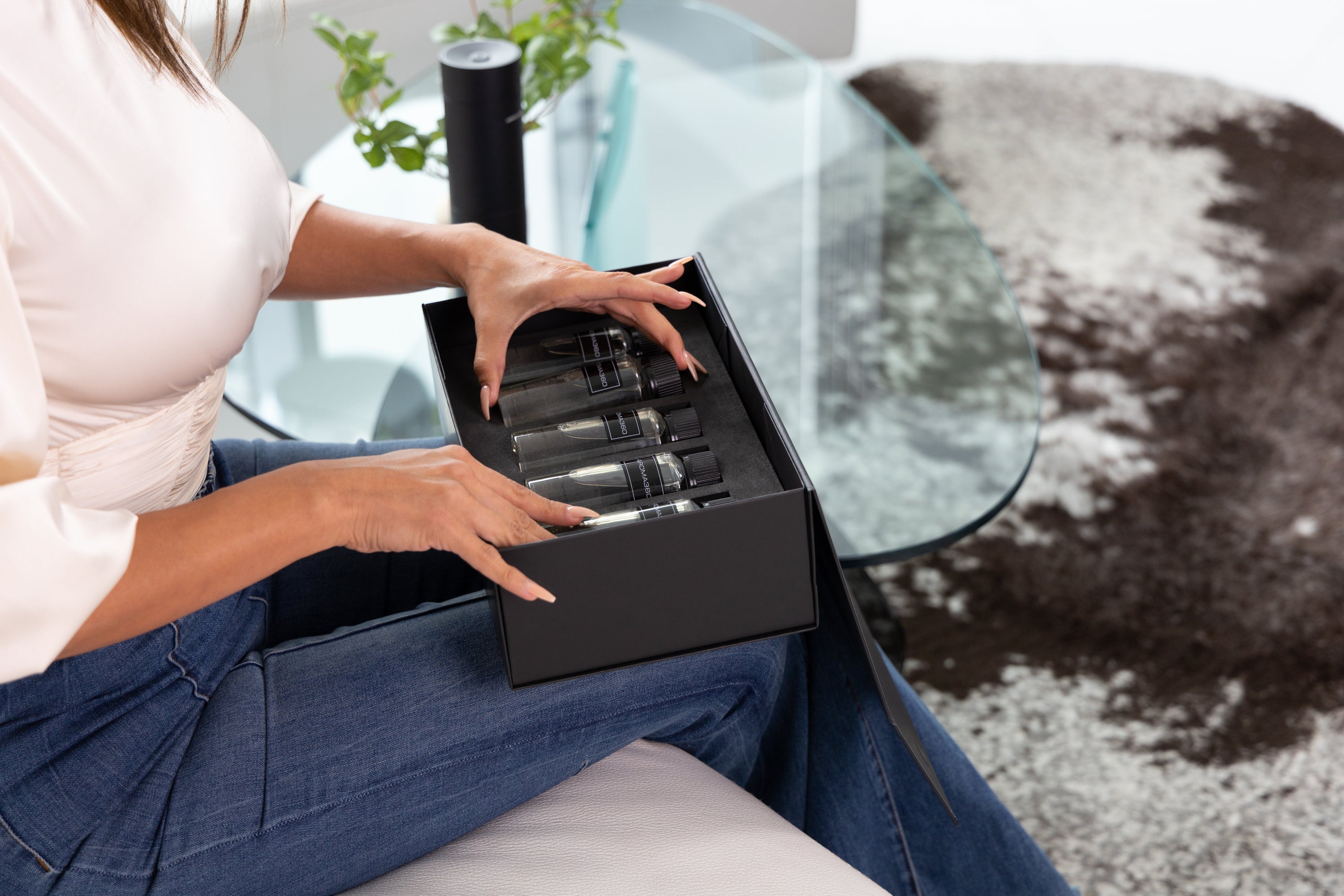 woman opening diffuser oils