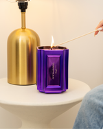 The Bougie Sand Wax Set features a 40oz scented sand wax, 30 candle wicks, and a stunning 33oz recyclable metallic vessel. Available in Blue, Red, Black, Green, and Purple scents, this eco-friendly, refillable candle set offers a sustainable and opulent ambiance.